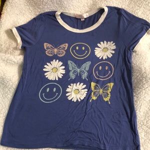 purple little girls medium shirt with smiley faces butterflies and daisy design